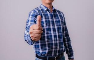 Asian engineer in striped shirt on white background photo