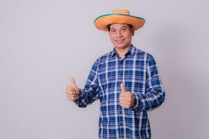 Asian farmer wearing striped shirt photo