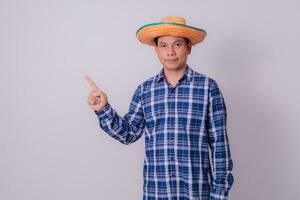 Asian farmer wearing striped shirt photo