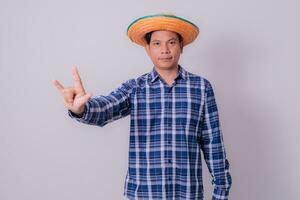 Asian farmer wearing striped shirt photo