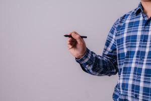 Asian engineer in striped shirt on white background photo