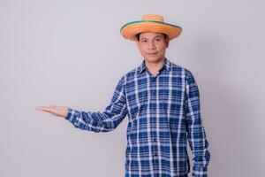 Asian farmer wearing striped shirt photo