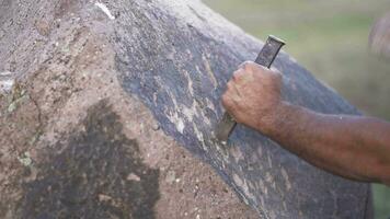 Ancient Man Cave Painting and Writing Historic Inscription Graffiti on Rock Surface With Iron Chisel video