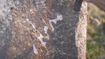 Ancient Man Cave Painting and Writing Historic Inscription Graffiti on Rock Surface With Iron Chisel video