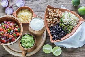 Chicken burrito bowl with the ingredients photo