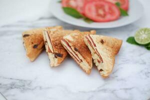 Sandwiches with ham, cheese and raisinsle background photo