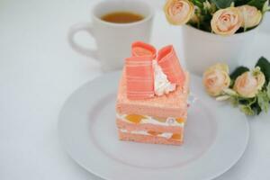 Slice of cake on white marble background. Selective focus. photo