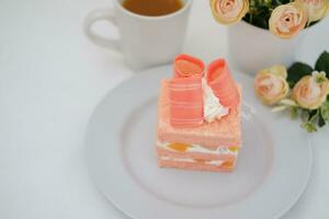 Slice of cake on white marble background. Selective focus. photo