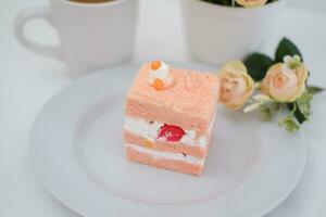 Slice of cake on white marble background. Selective focus. photo