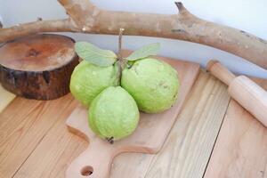 guava fruit on wood background photo