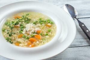 Italian chicken pasta soup with parmesan photo