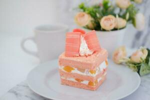 Slice of cake on white marble background. Selective focus. photo