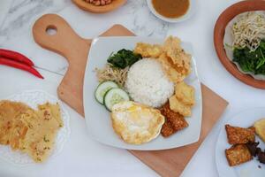 Thai food with rice, fried tofu, shrimp paste, sweet and sour sauce photo