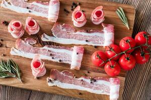 Bacon strips with cherry tomatoes photo