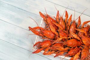 Tray with boiled crayfish photo