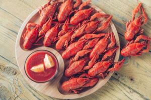 Dish of boiled crayfish with sauce photo