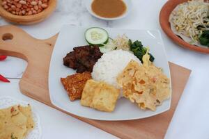 Thai food with rice, fried tofu, shrimp paste, sweet and sour sauce photo