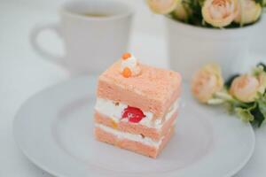 Slice of cake on white marble background. Selective focus. photo