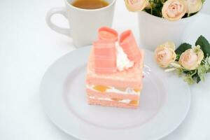 Slice of cake on white marble background. Selective focus. photo