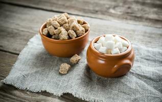 Bowls of white and brown sugar photo