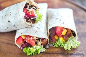 Three chicken burritos photo