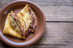 Crepes with chocolate cream photo