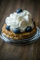 Waffle with whipped cream and blueberries photo