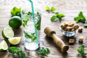 Glass of mojito with ingredients photo