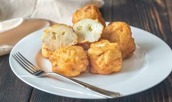 Fried cauliflower coated in batter photo