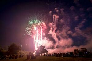 People looking at fireworks in honor of Independence Day photo