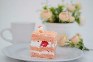 Slice of cake on white marble background. Selective focus. photo