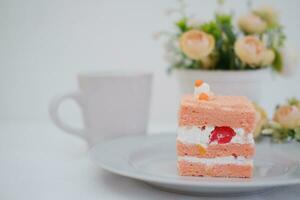 Slice of cake on white marble background. Selective focus. photo