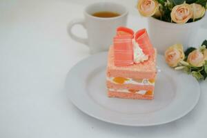 Slice of cake on white marble background. Selective focus. photo