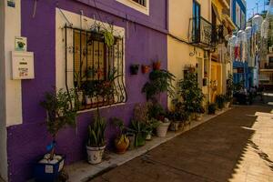 nnarrow streets of the old town in Calpe Spain on a summer hot holiday day photo