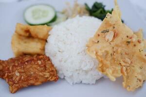 Thai food with rice, fried tofu, shrimp paste, sweet and sour sauce photo