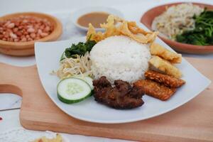 Thai food with rice, fried tofu, shrimp paste, sweet and sour sauce photo