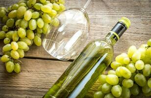 White wine with bunch of grape photo