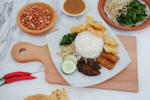 Thai food with rice, fried tofu, shrimp paste, sweet and sour sauce photo