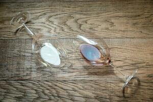 Glasses with red and white wine on the wooden background photo