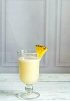 Glass of pina colada photo