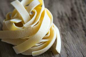 Raw fettuccine pasta photo