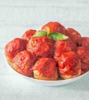 Bowl of meatballs with tomato sauce photo