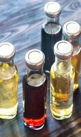 Bottles with different kinds of vinegar photo