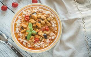 Thai red chicken curry with white rice photo