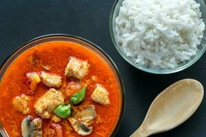 Thai red chicken curry with white rice photo