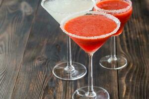 Glasses of lime and strawberry margarita cocktail photo