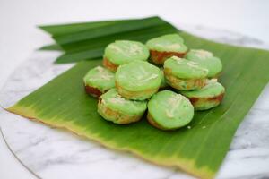 Pandan flavored cake with beautiful green leaves photo