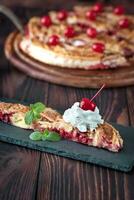 Portion of cherry custard pie photo