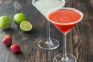 Glasses of lime and strawberry margarita cocktail photo