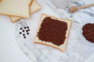 Sandwich with chocolate and coffee on a wooden board, stock photo